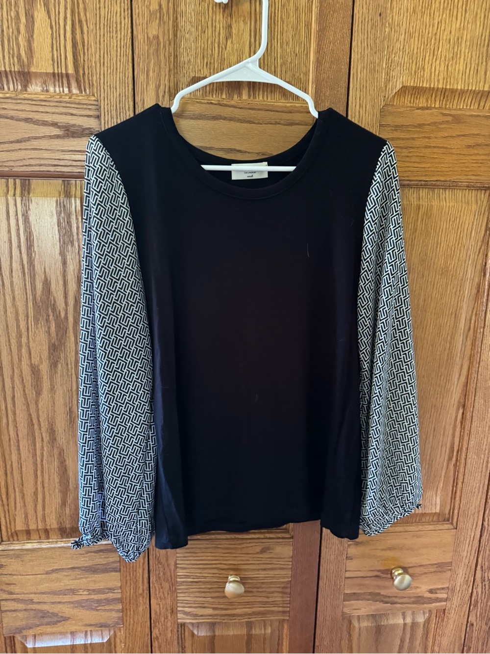 Kim & Cami Black Top with Geometric-Patterned Long Sleeves